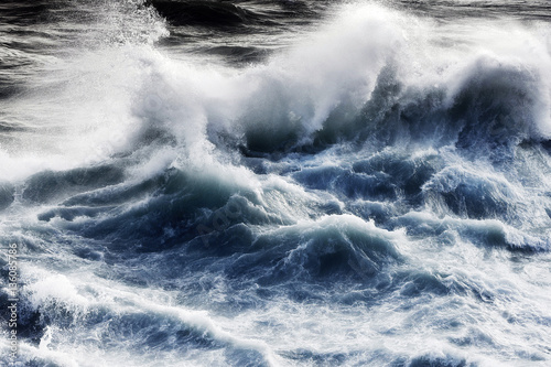 giant waves in storm day breaking in atlantic ocean
