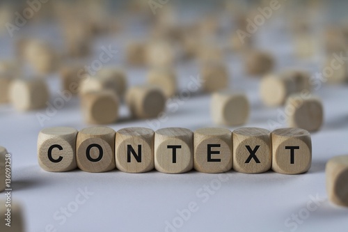 context - cube with letters, sign with wooden cubes