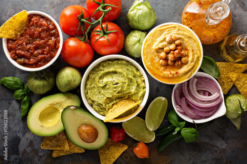 Homemade hummus, salsa and guacamole with corn chips