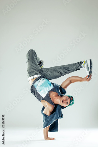 Man break dancer on white studio background