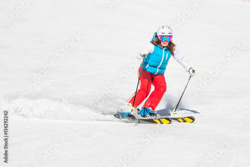 Skier girl while ago slalom curves