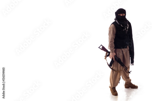 man in military outfit warrior Mujahedin in modern times on a white background in studio