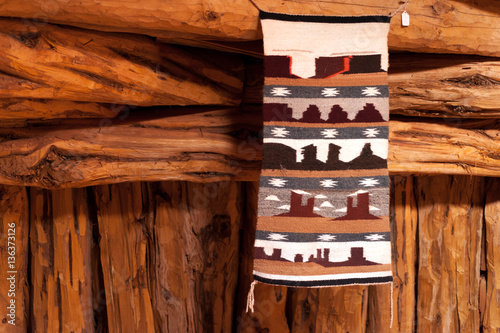 Traditional handmade wool Navajo rug with Monument Valley elements 