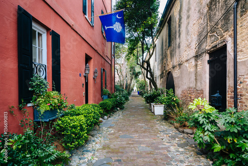 Narrow cobblestone street and old buildings in Charleston, South