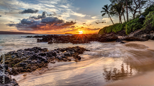 a dramatic sunset on the tropical island of Maui, Hawaii from secret cove