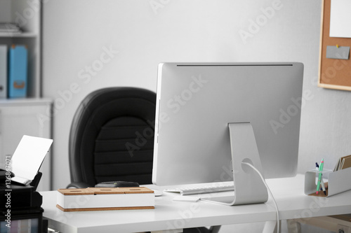 Workplace with computer in modern office