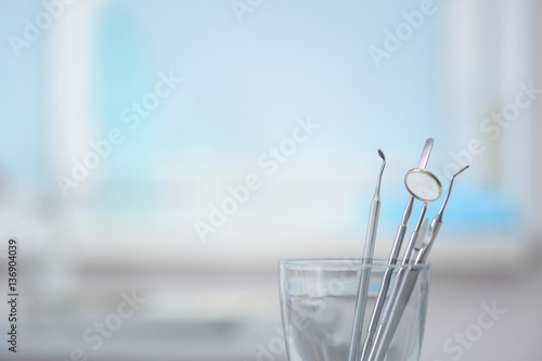 Dentist medical tools in glass