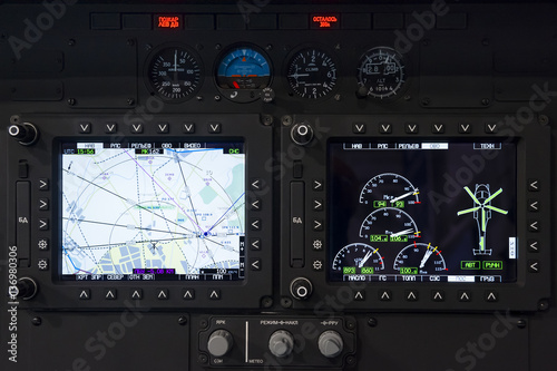 Control panel in military helicopter cockpit, copter dashboard with displays, dials, buttons, switches, faders, knobs, other toggle items, air force, modern aviation and aerospace industry 