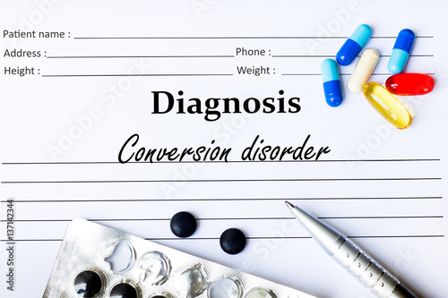 Conversion disorder - Diagnosis written on a piece of white paper with medication and Pills