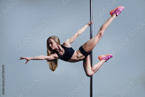 Young slim pole dance woman.