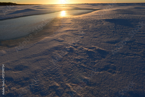 Sunrise in the snowy wilderness on the Gulf of Finland