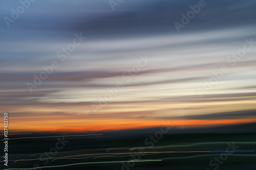 motion blurred line sky in sunset abstract nature blur background.