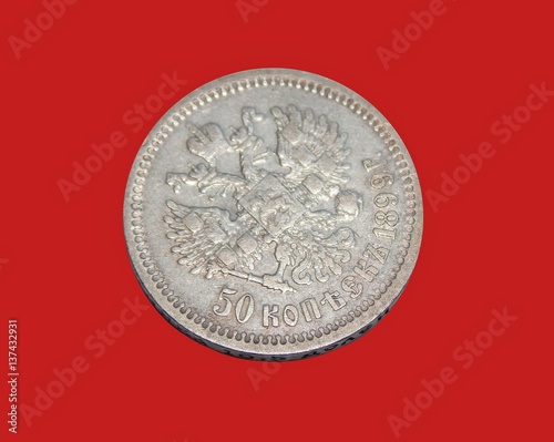 old Russian silver coin 50 kopecks 1899 in the isolation of a red background