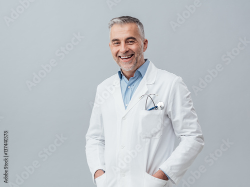 Cheerful doctor posing