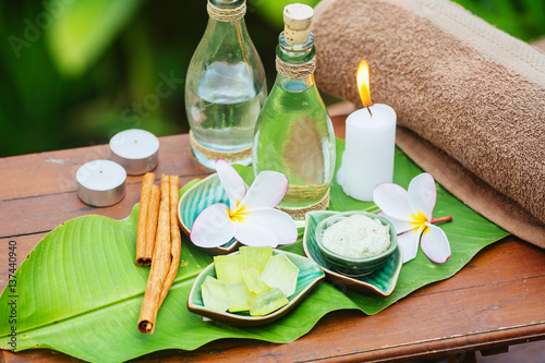 Spa still life with frangipani, towel, candles, fresh aloe