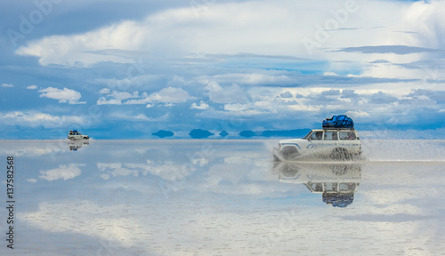 Off-road vehicles driving in Salar de Uyuni, Bolivia, the world's largest salt flat