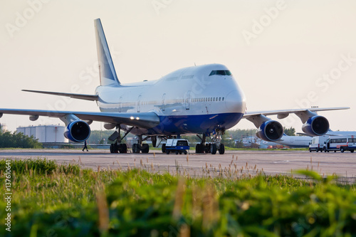 Boeing 747 on the airfield. Long-haul aircraft. Ready to takeoff on the runway. Passenger commercial air transportation.