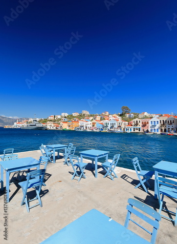 Blu tables-chairs-tavern on the central side-main harbor. Kastellorizo-Greece. 1723