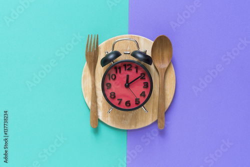 Meal time with alarm clock at lunch time
