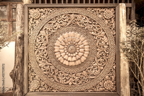 Carved wood decoration in Thailand. Sepia tone
