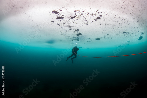 Scuba diver under the ice