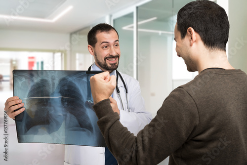 Doctor showing a radiography to a patient