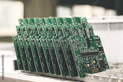 Computer board with chips at the factory for the production of computer components.