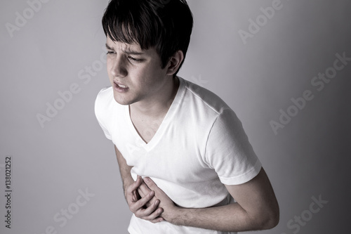 young man having a stomachache