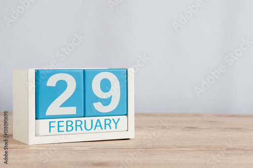 February 29th. Cube calendar for february 29 on wooden surface with empty space For text. Leap year, intercalary day