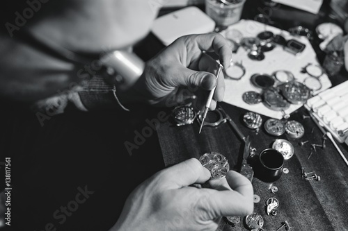 portrait of watchmaker repairing a watch