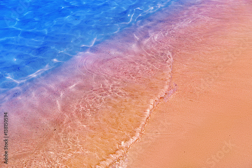 Famous pink sand beach Elafonisi, Crete, Greece. Beautiful seashore and blue sea.
