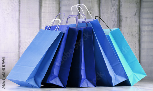 Composition with blue paper shopping bags