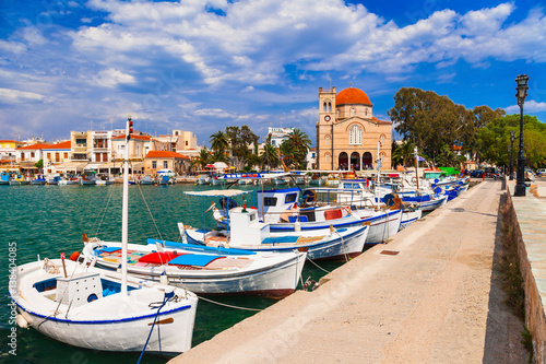 Saronics islands of Greece .Authentic beautiful Greek island -Aegina with traditional fishing boats and St. Nicholas Church