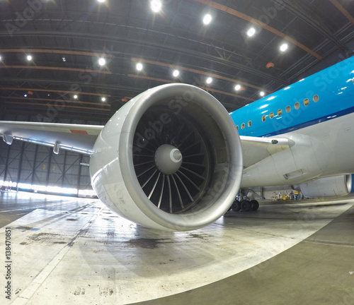 big jet plane inside hangar