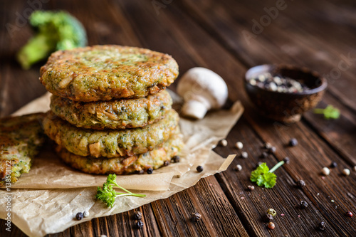 Fried vegetarian broccoli burgers with mushrooms and garlic