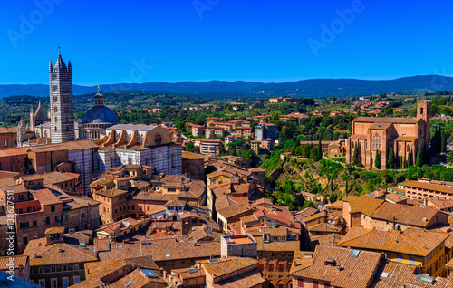 View of Siena and Basilica of San Domenico (Basilica Cateriniana) and Siena Cathedral Santa Maria Assunta (Duomo di Siena) in Siena, Tuscany, Italy