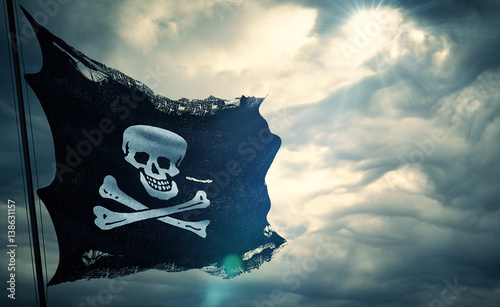 ripped tear grunge old fabric texture of the pirate skull flag waving in wind, calico jack pirate symbol at cloudy sky with sun rays light, dark mystery style, hacker and robber