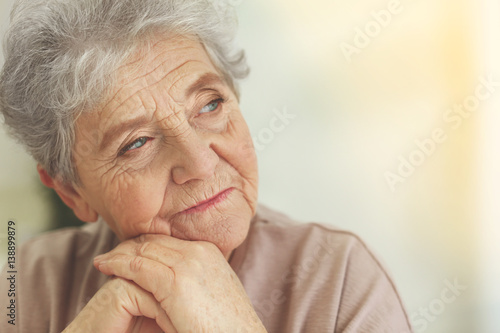 Depressed elderly woman at home