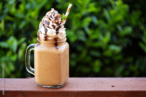 Chocolate frappe coffee with whipped cream outside