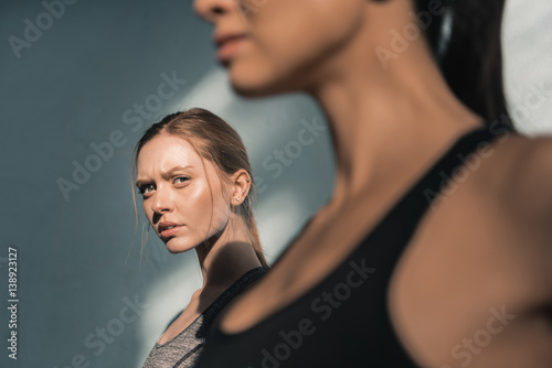 portrait of young sporty women in gym