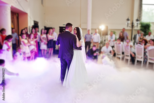 Awesome first wedding dance with smoke and rose purple lights.