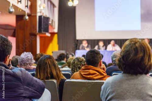 people at the conference in the conference hall