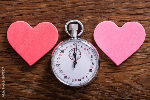Speed Dating Concept. Hearts And A Stop Watch