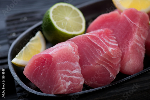 Close-up of fresh uncooked slices of tuna fillet, selective focus