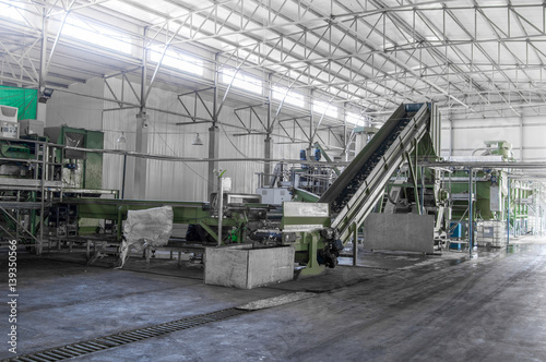 escalator at the factory for processing and recycling of plastic bottles. PET recycling plant
