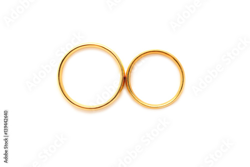 Golden wedding rings isolated on a white