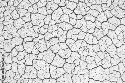 Soil drought cracks texture white background for design.