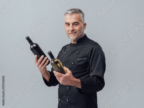 Chef choosing a wine bottle