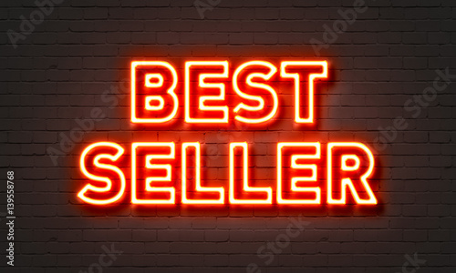 Bestseller neon sign on brick wall background.