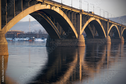 Bridge Communal over the Yenisei river in Krasnoyarsk in spring evening